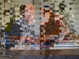 sikh couple filling in jigsaw