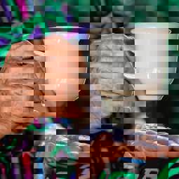 close up woman holding a teacup